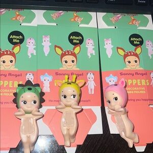 Three-Piece Animal Hood Baby Figurine Set - Yellow, Green, Pink